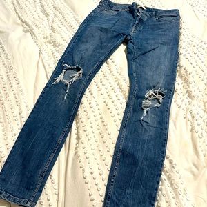 Topman stretch skinny jeans with holes in the knee.